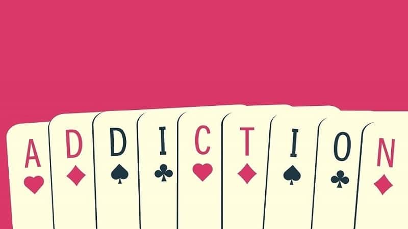 playing cards spelling out addiction in reference to gambling addiction