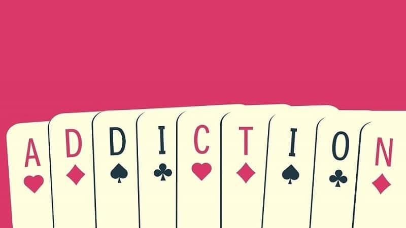 playing cards spelling out addiction in reference to gambling addiction